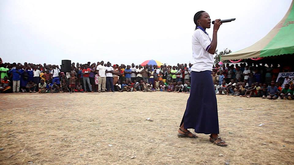 Community Health Worker, Diana Nguka, performing a Maji Safi Group original song 